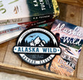 Load image into Gallery viewer, Officially Licensed K.A. Tucker "Alaska Wild Round Sign" created by FireDrake Artistry®
